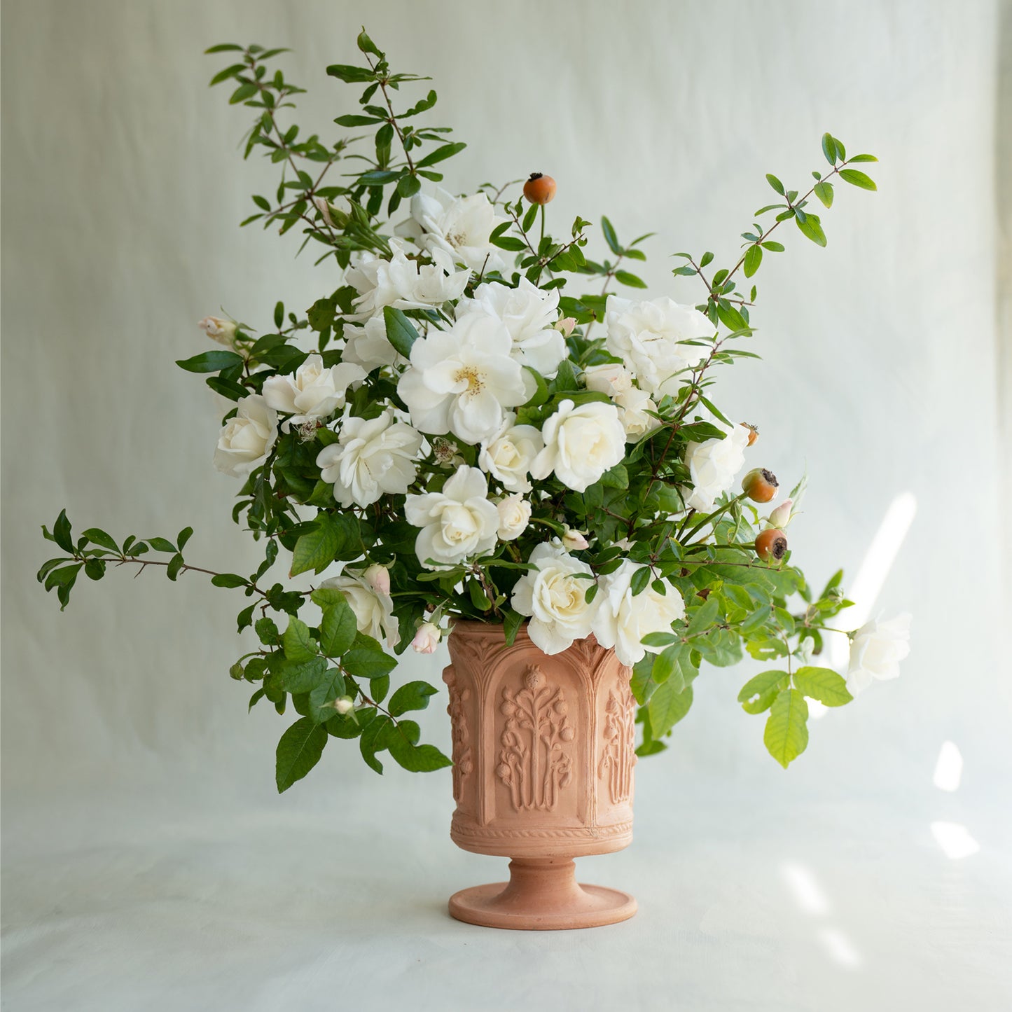 The Floral Folly Urn in Terracotta