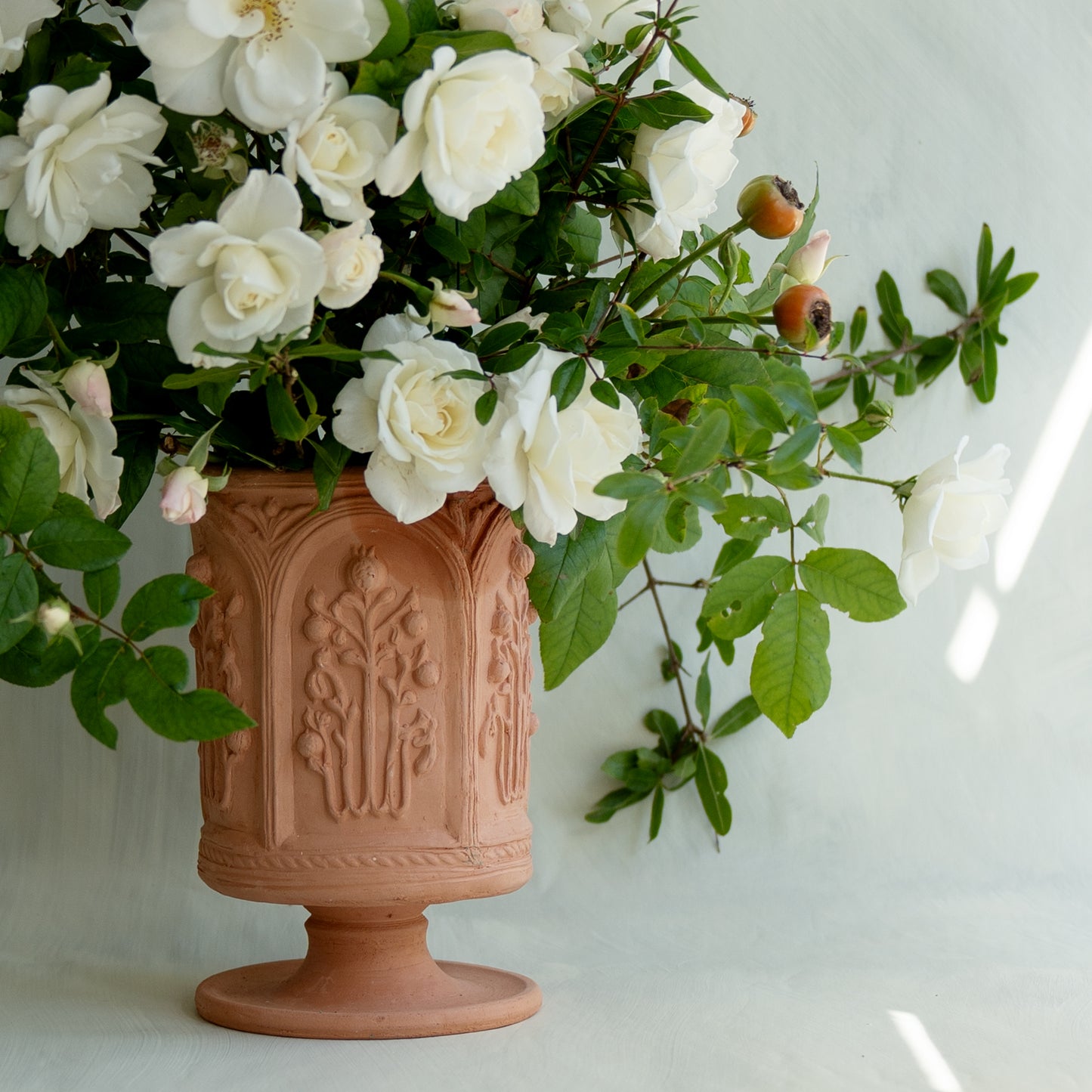 The Floral Folly Urn in Terracotta